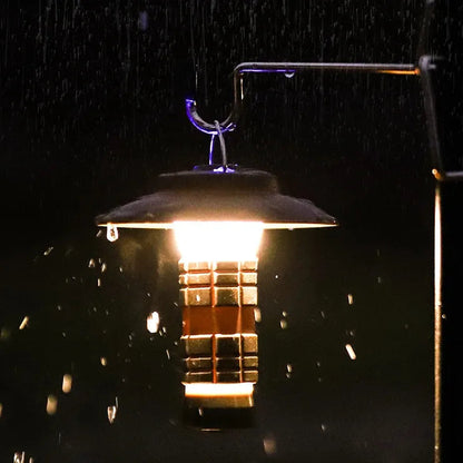 Water-resistant multifunction camping light hanging in the rain